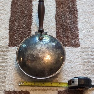 Vintage-silver-plated "silent butler" or crumb catcher, featuring a coat of arms